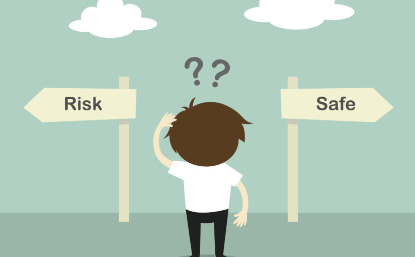 Risk versus safe - businessman confused about two direction, between risk or safe.